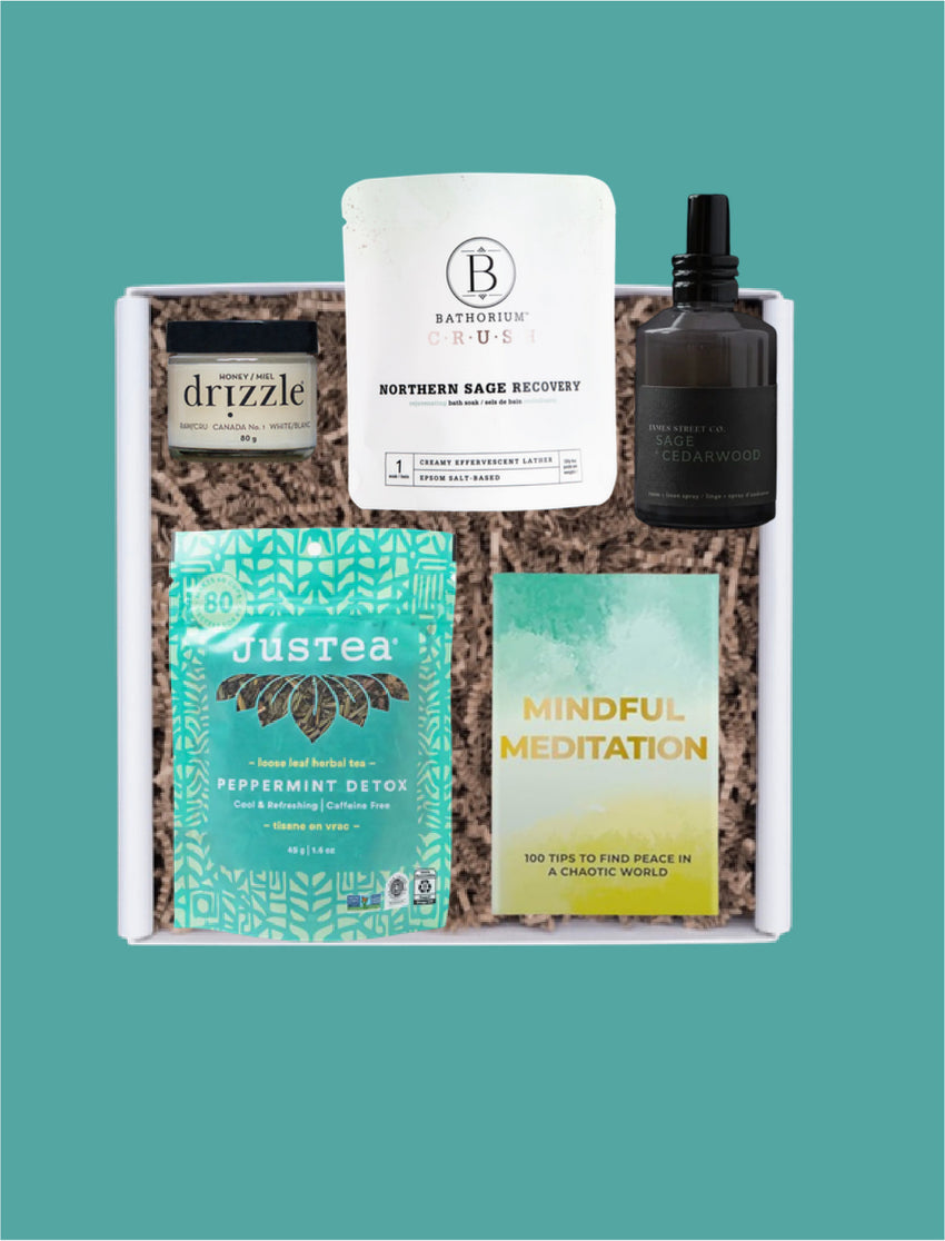 The Deep Rest corporate wellness gift box opened with JusTea herbal tea, Drizzle honey, Bathorium bath soak, linen spray and meditation cards.
