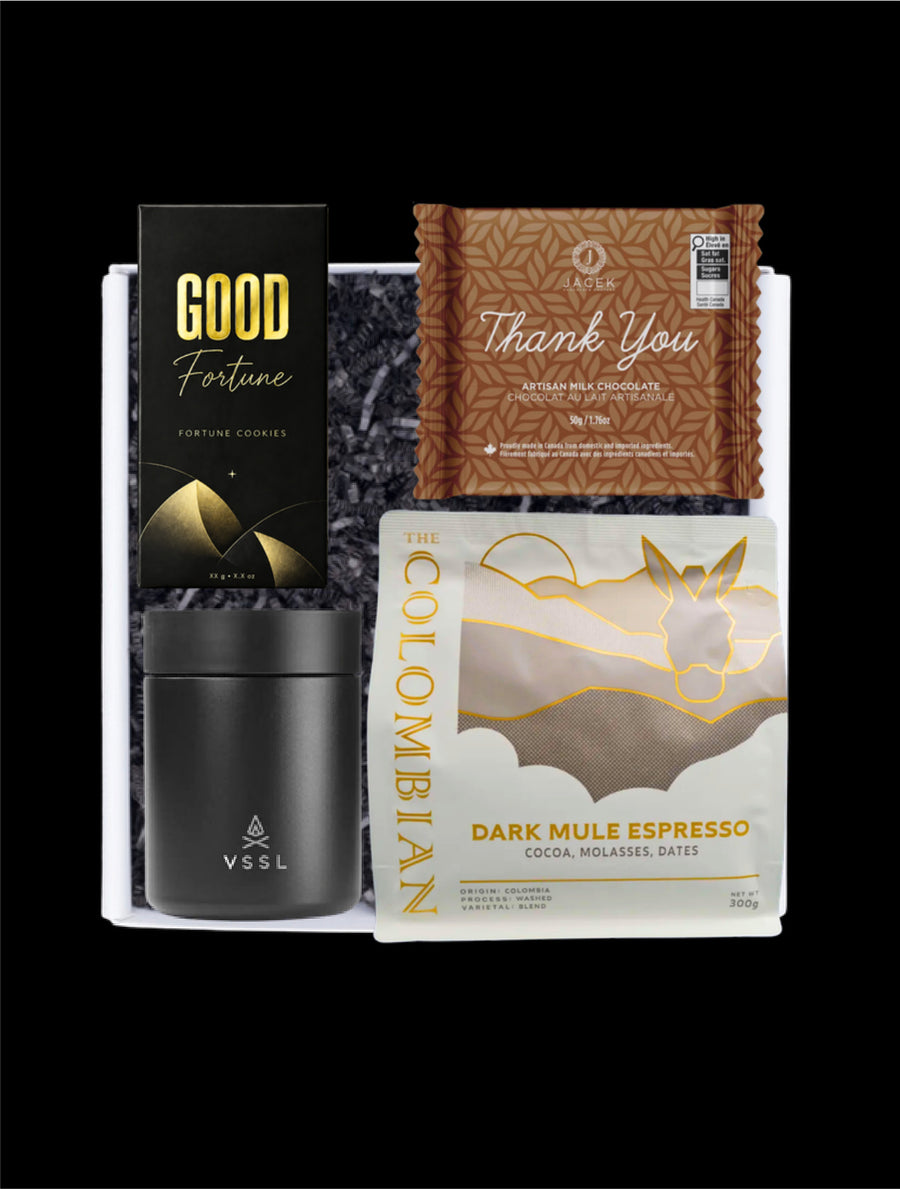 Good Fortune gift selection with fortune cookies, a VSSL travel mug, espresso and a JACEK Thank You chocolate bar.