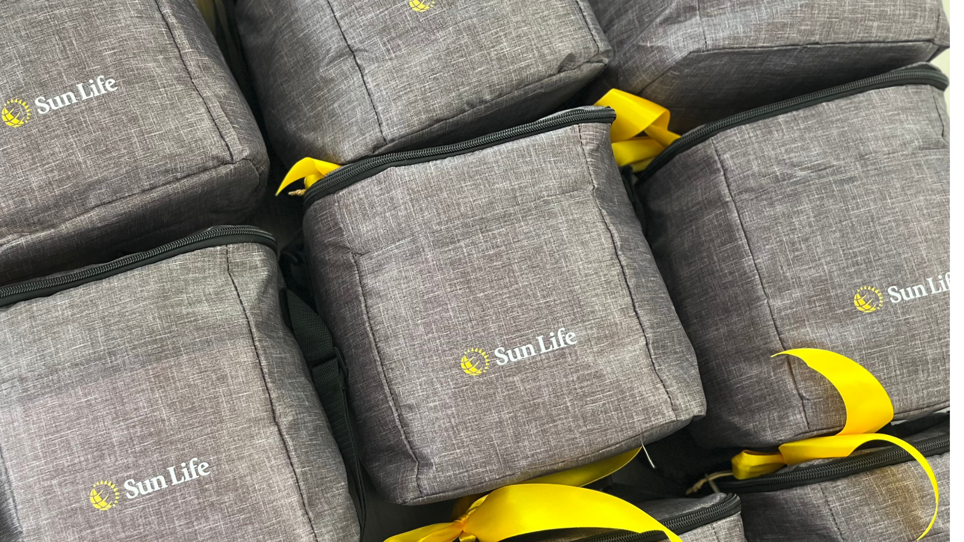 Sun Life Financial branded cooler bag with yellow ribbons