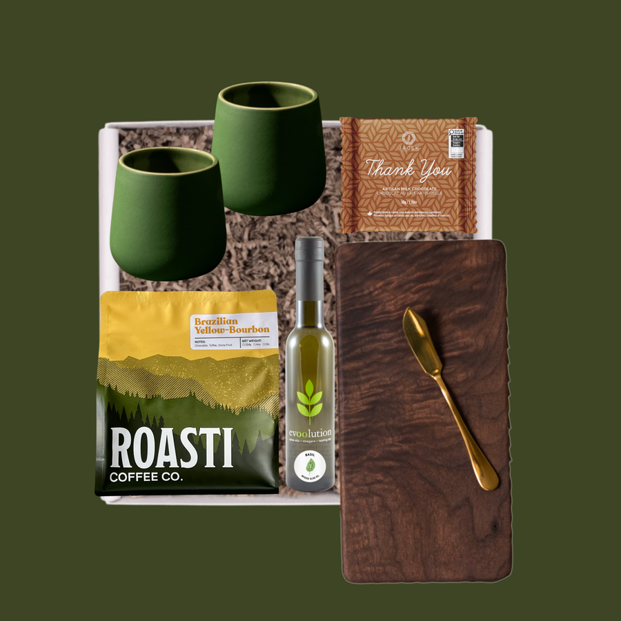 Handcrafted walnut cutting board and green stoneware mugs, olive oil chocolate and gourmet coffee by Roasti,  in a luxury realtor closing gift box by Gray Jay Gifts Edmonton.