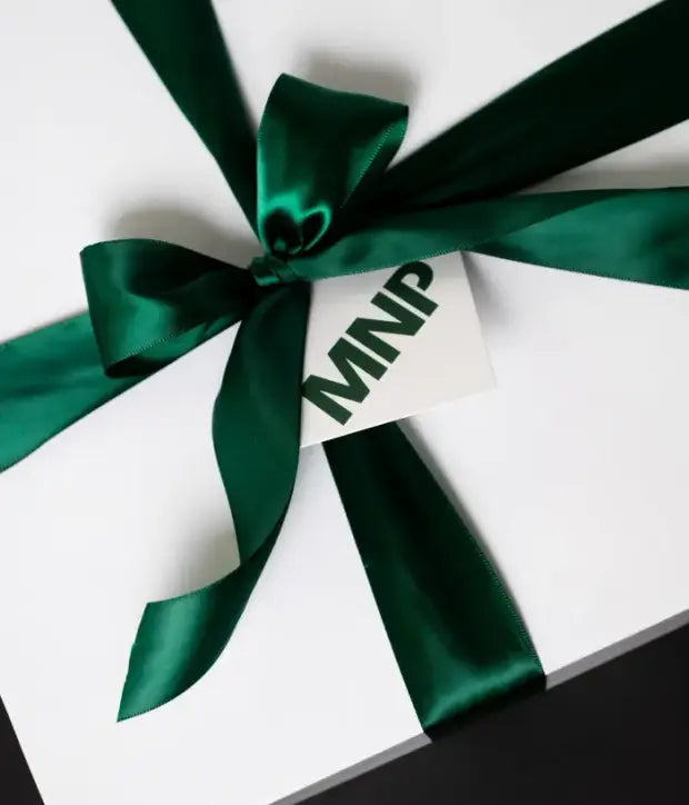 MNP gift box with green satin ribbon and a branded tag