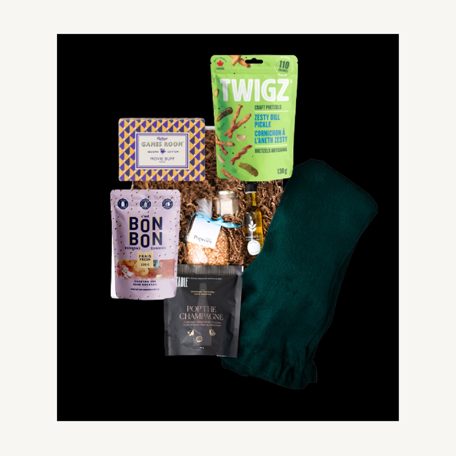 The Movie Night gift selection with a green alpaca throw, Movie Buff Trivia, Twigz pretzels, gummies and gourmet popcorn.