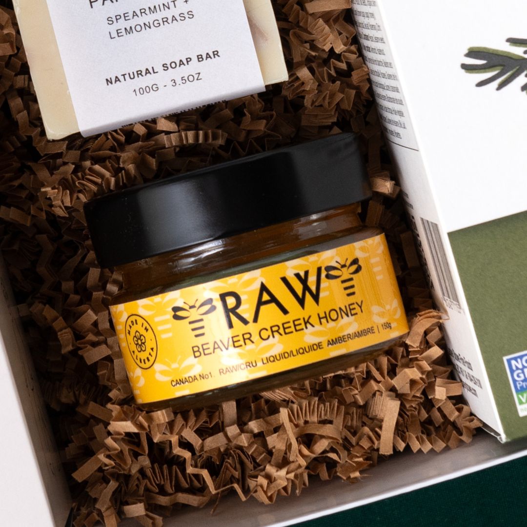 Beaver Creek raw honey beside Oak & Aspen soap in a housewarming gift box.