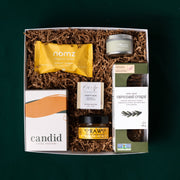 The New Home gift box with Candid coffee, Nomz bites, Beaver Creek honey, Raincoast Crisps, a Misiyo candle and Oak & Aspen soap.