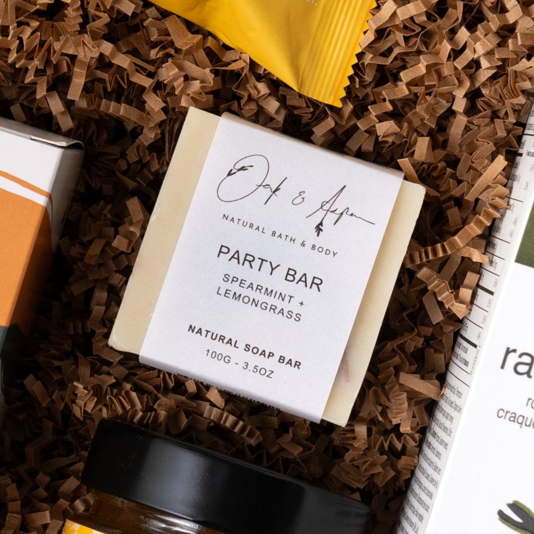 Close-up of an Oak & Aspen natural soap bar in The New Home gift.